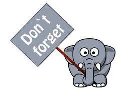 Image of elephant holding a sign that reads, 